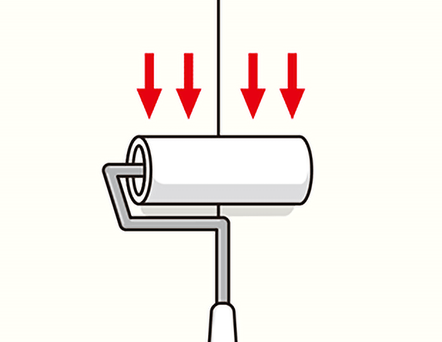 のり付け後はローラーで押さえる