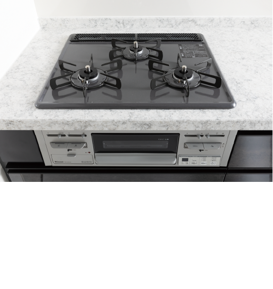 グリル付三口コンロ,バーナーリング一体化のホーローフラットトッププレートを採用。温度センサーも搭載し、安全性にも考慮しています。